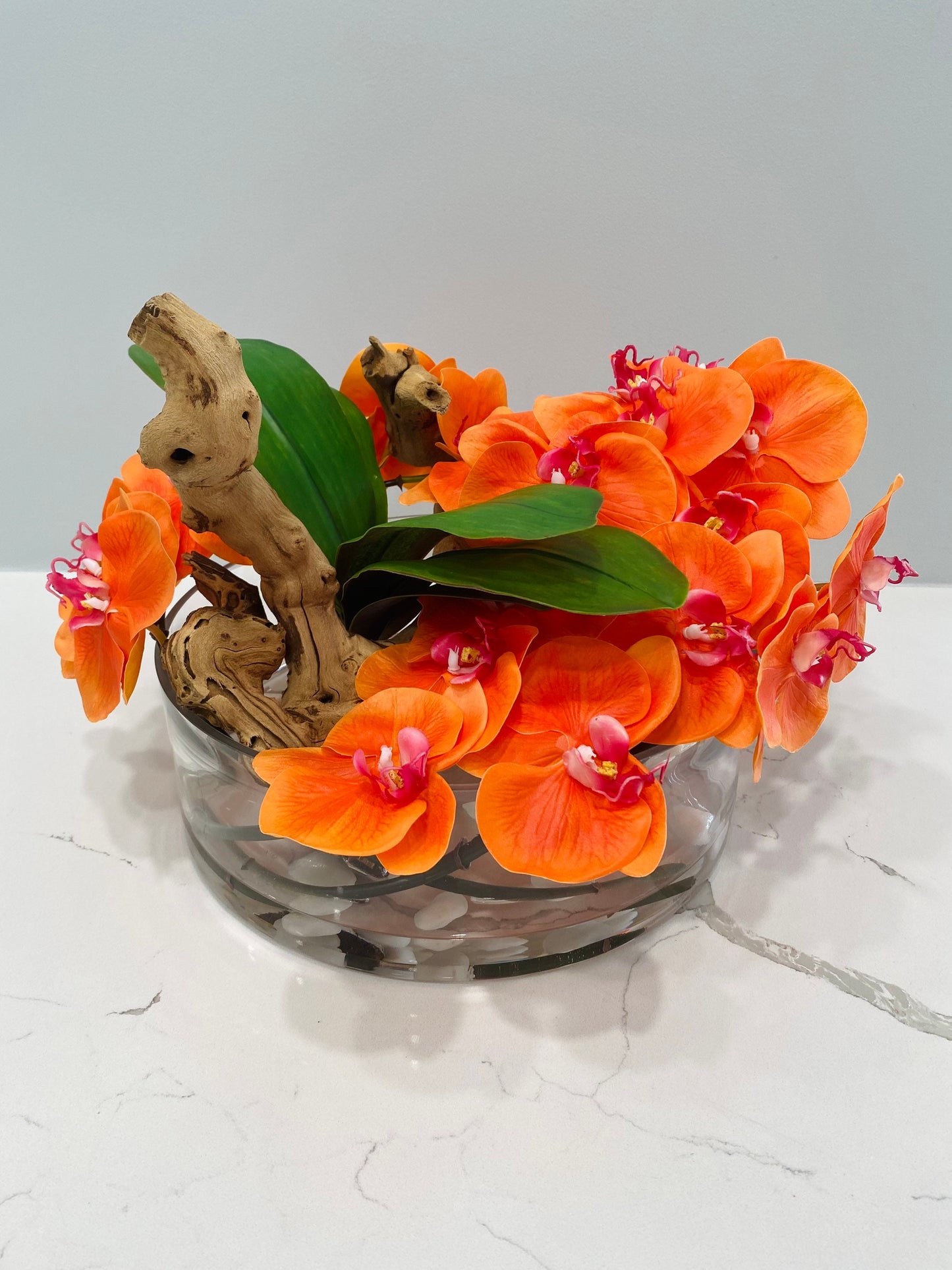 BOWL WITH WHITE ORCHIDS AND WOOD