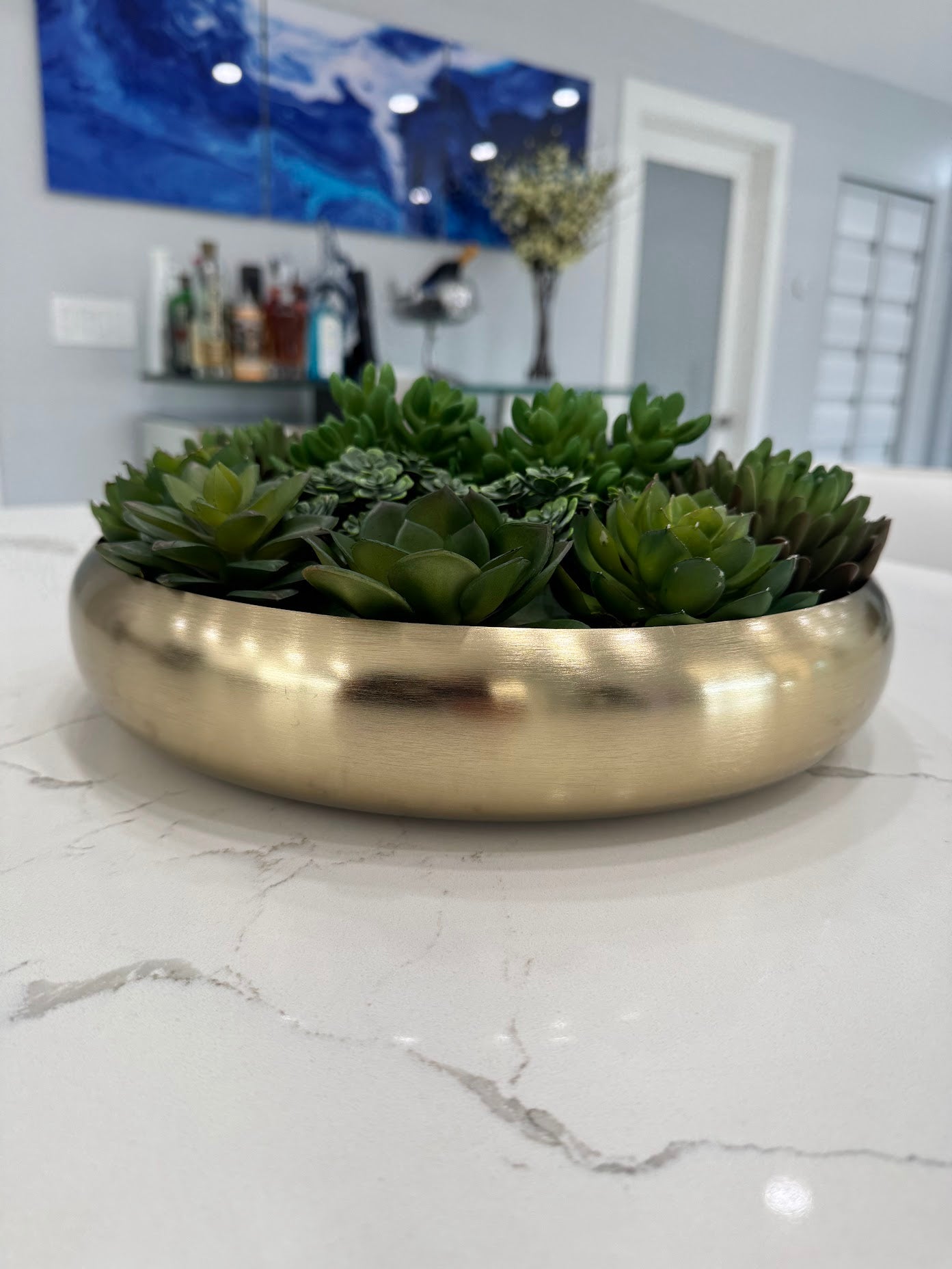 ARTIFICIAL SUCCULENT CENTERPIECE IN GOLD BOWL