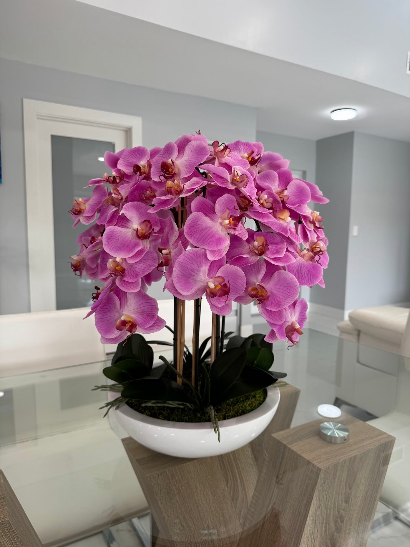 PINK ORCHIDS IN WHITE VASE