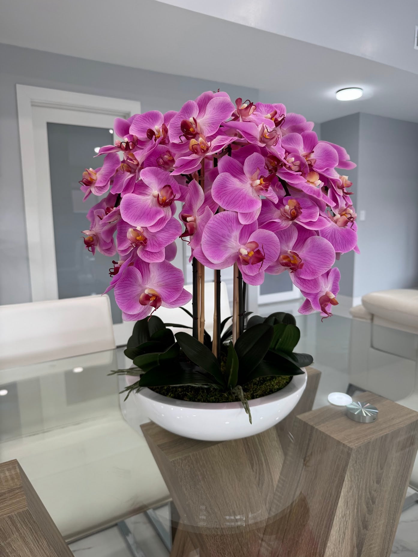 PINK ORCHIDS IN WHITE VASE
