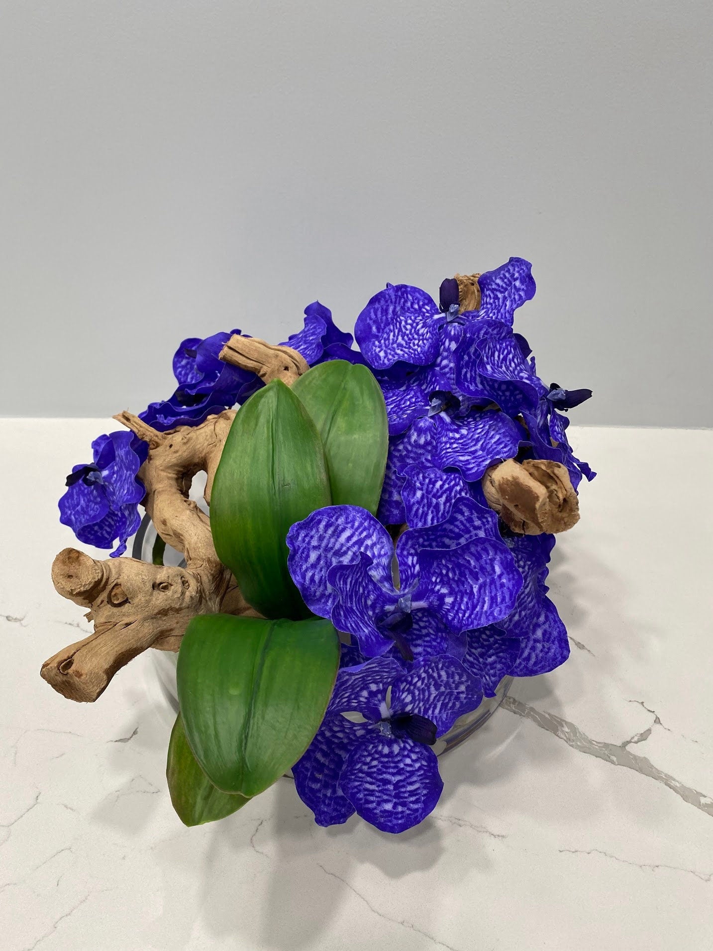 BOWL WITH ORCHIDS AND WOOD