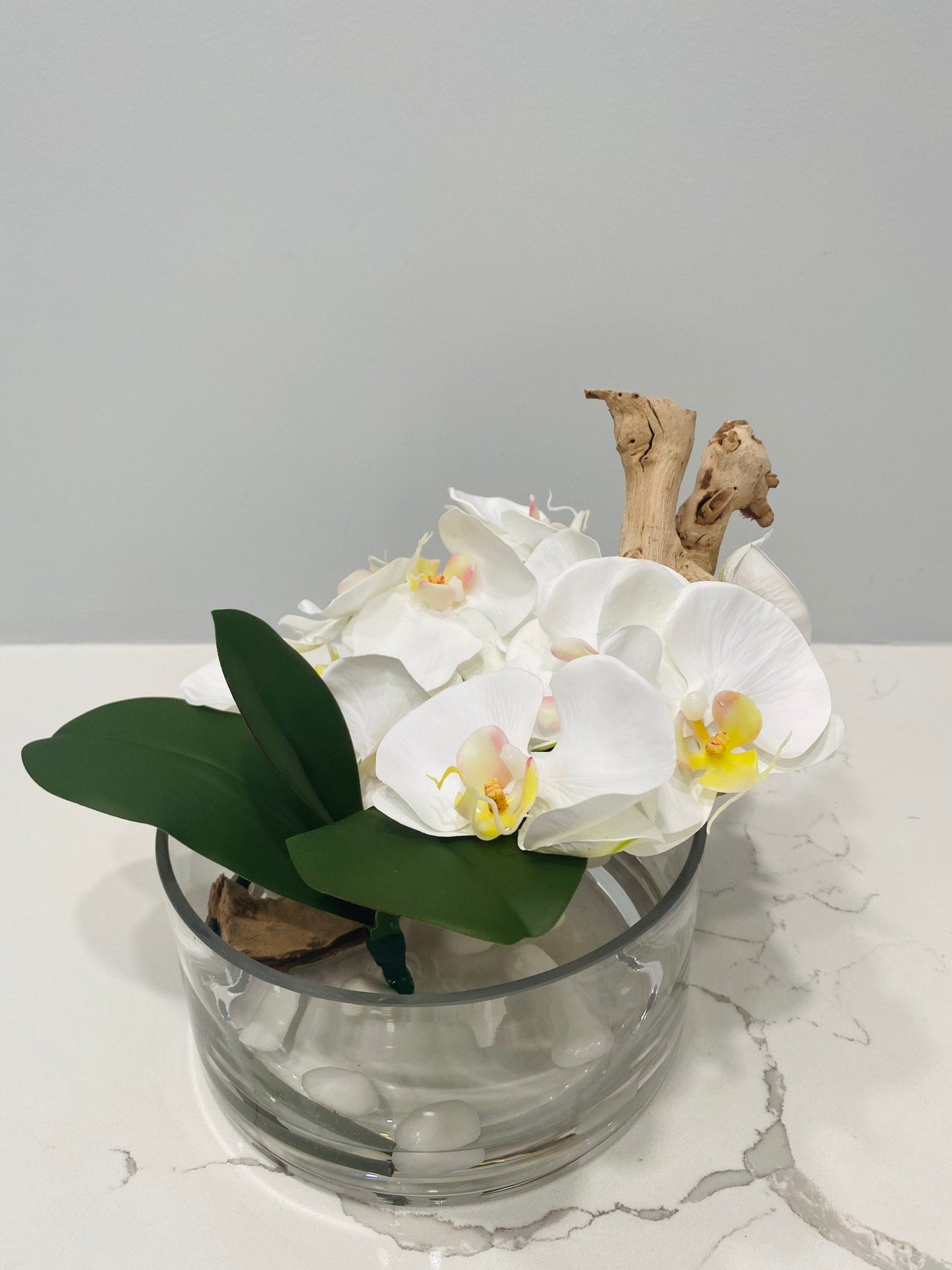 BOWL WITH WHITE ORCHIDS AND WOOD