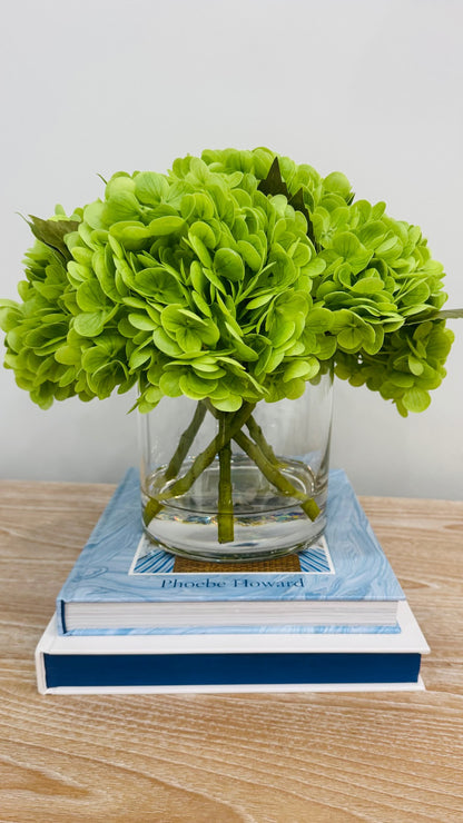 GREEN HYDRANGEAS IN CYLINDER VASE