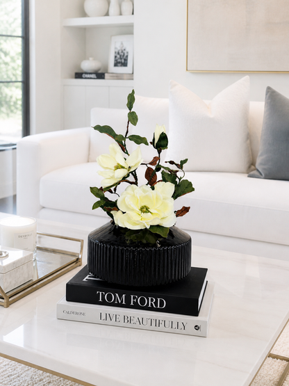 MAGNOLIA WITH BRANCH IN BLACK VASE