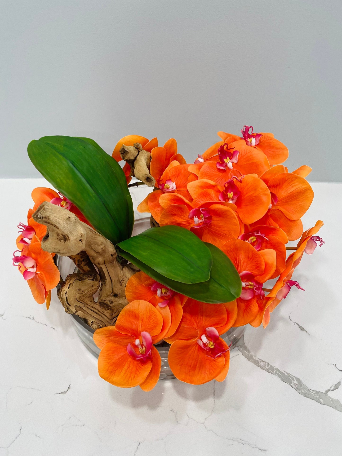 BOWL WITH WHITE ORCHIDS AND WOOD