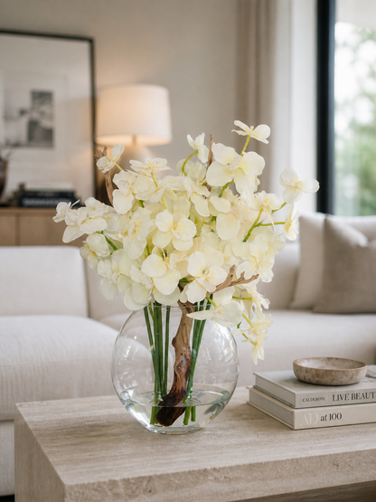 ORCHIDS IN MOON VASE