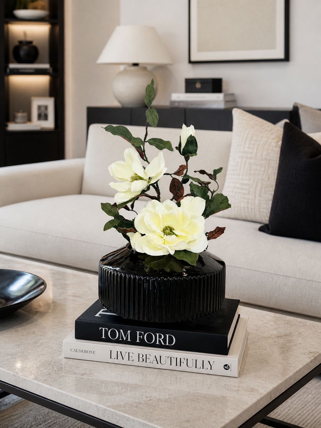 MAGNOLIA WITH BRANCH IN BLACK VASE