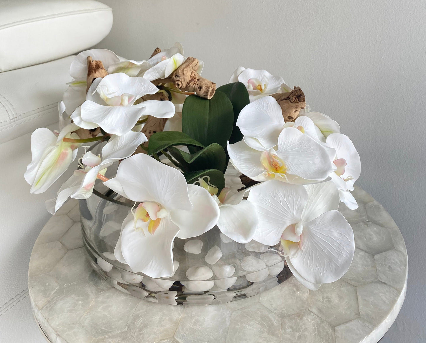 BOWL WITH WHITE ORCHIDS AND WOOD