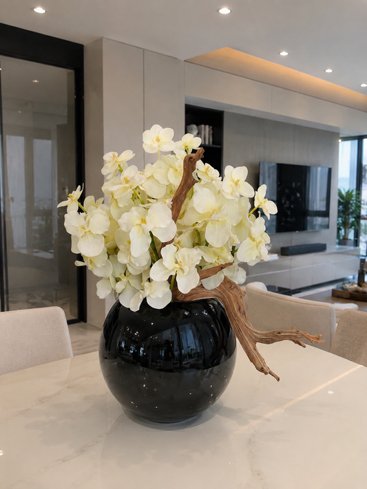 WHITE ORCHID DRIFTWOOD ARRANGEMENT IN BLACK GLOBE VASE