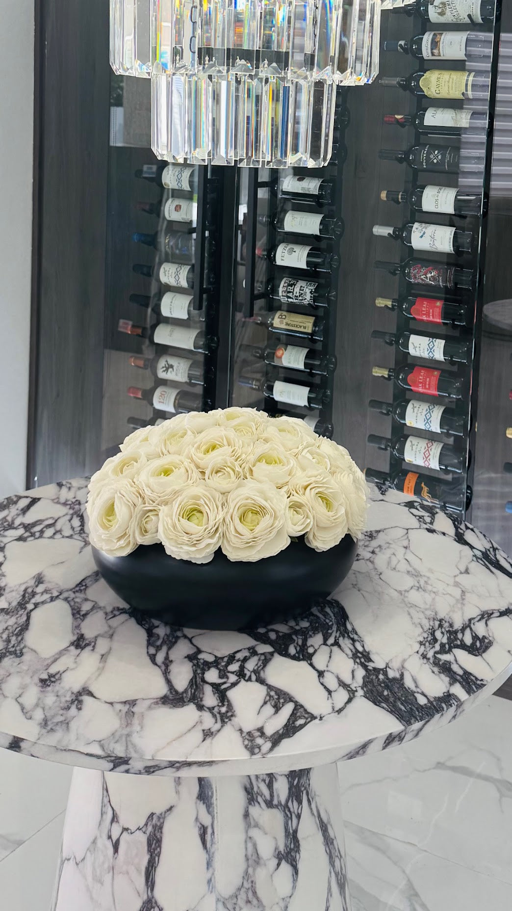 RANUNCULUS IN CERAMIC BLACK VASE