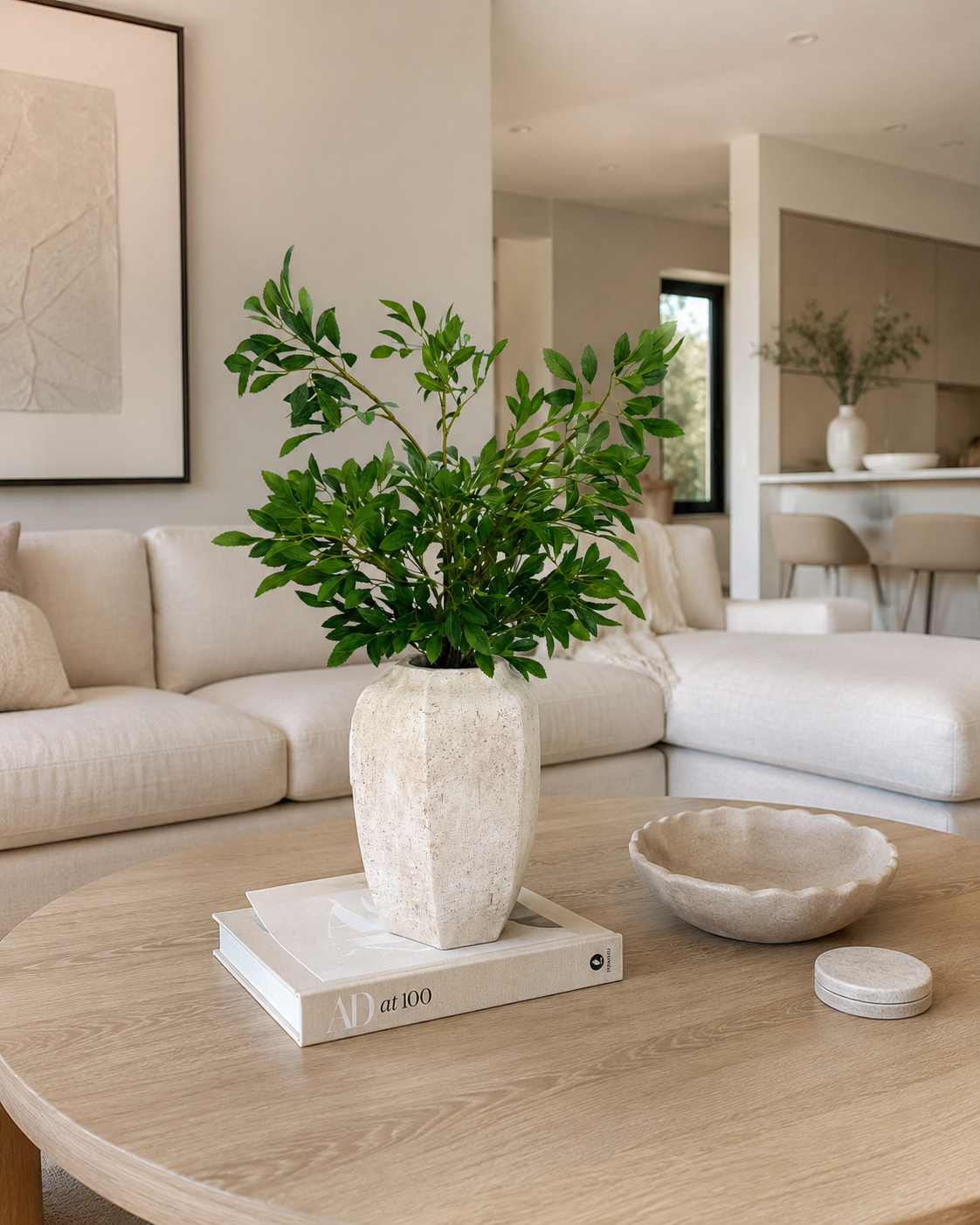 GREEN FOLIAGE ARRANGEMENT IN TEXTURED STONE VASE
