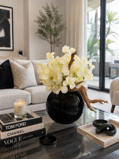 WHITE ORCHID DRIFTWOOD ARRANGEMENT IN BLACK GLOBE VASE