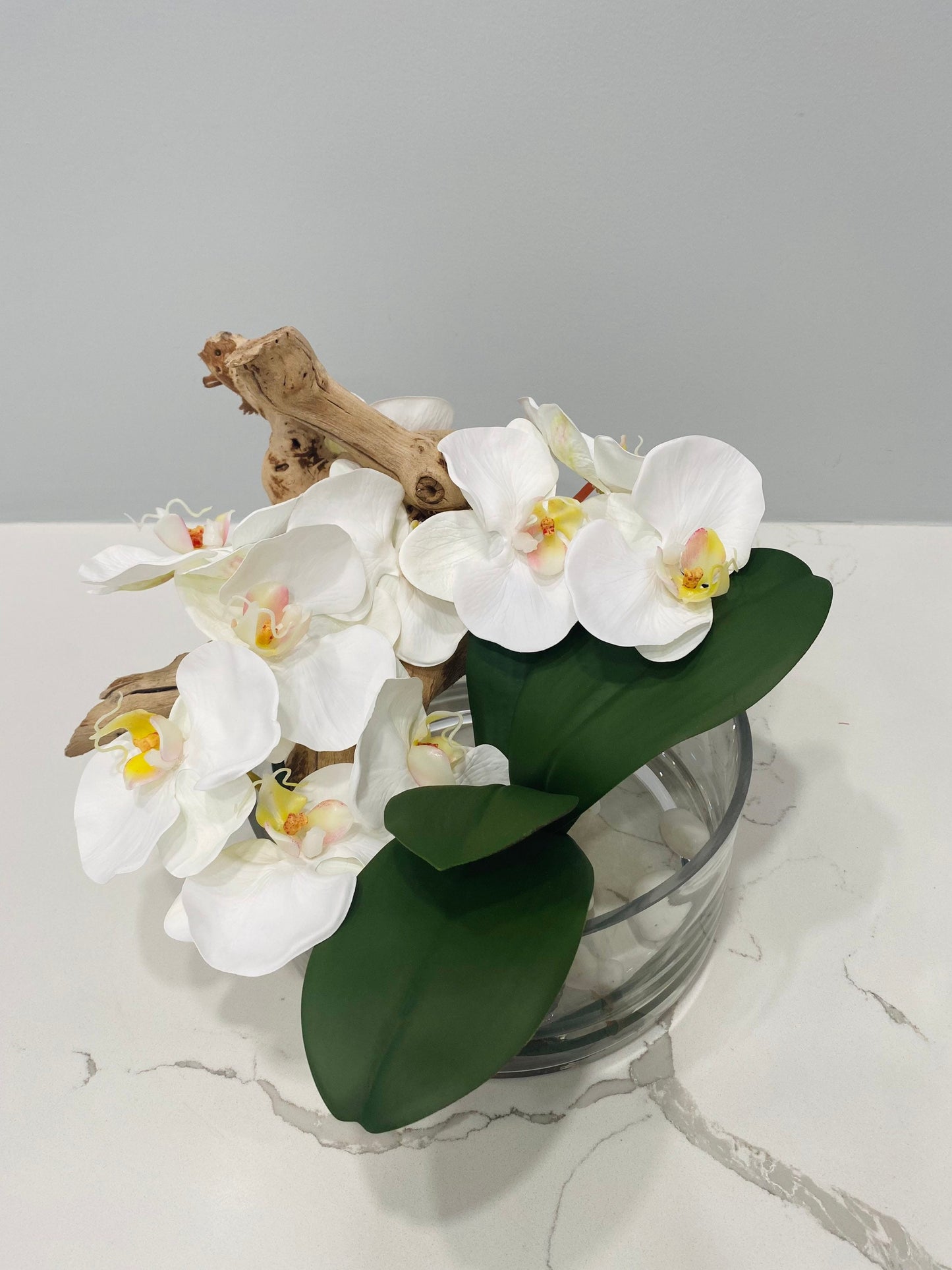 BOWL WITH WHITE ORCHIDS AND WOOD