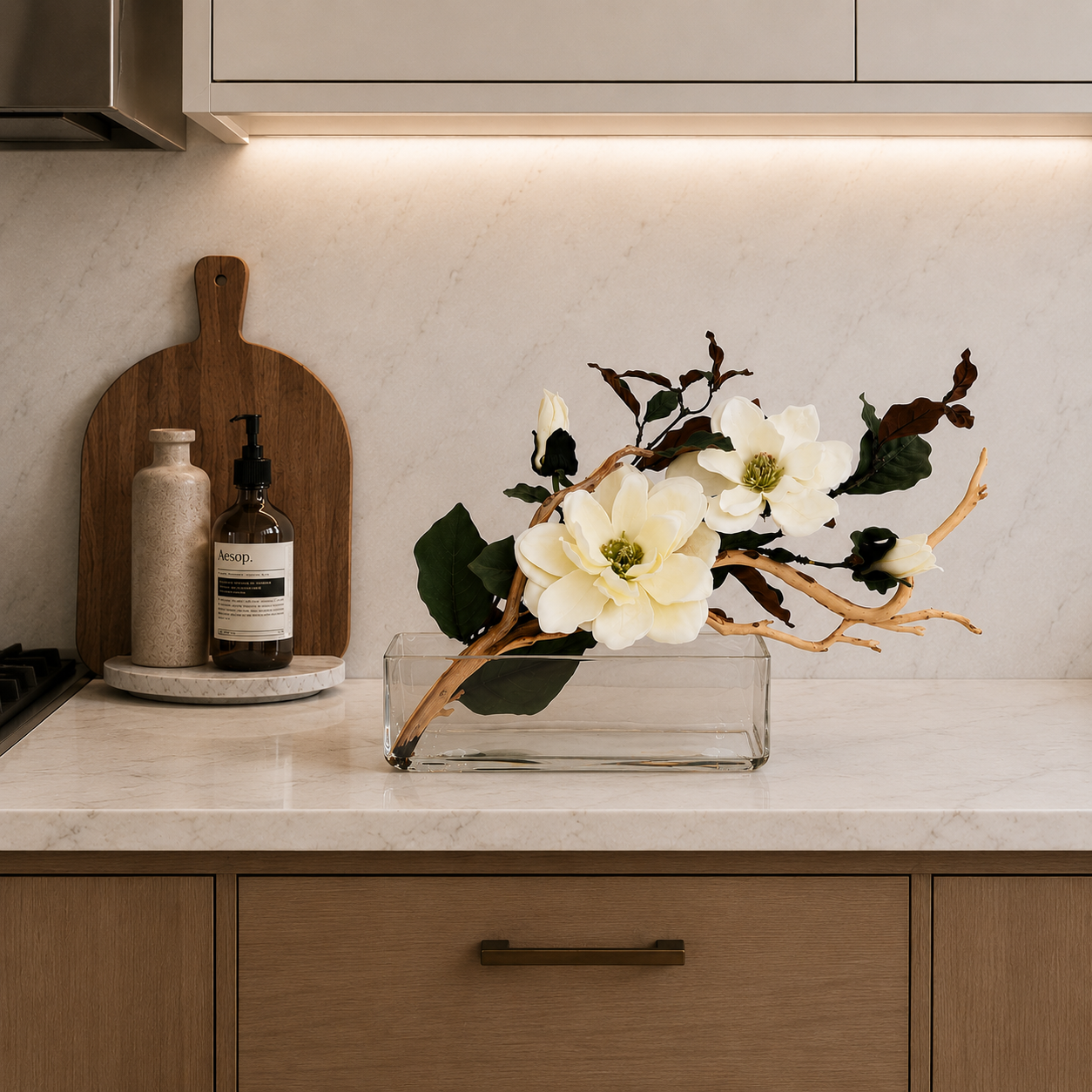 MAGNOLIA WITH BRANCH AND WOOD IN RECTANGULAR VASE