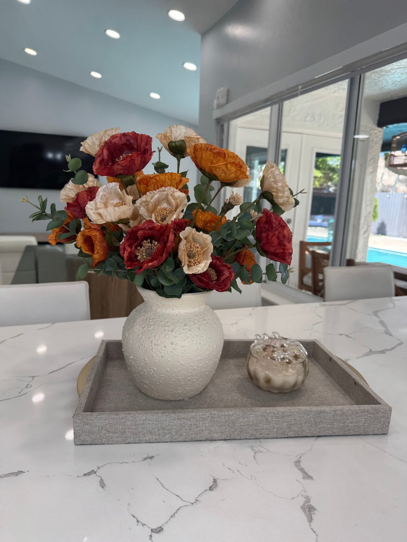 AUTUMN POPPY FLORAL ARRANGEMENT IN TEXTURED CREAM VASE