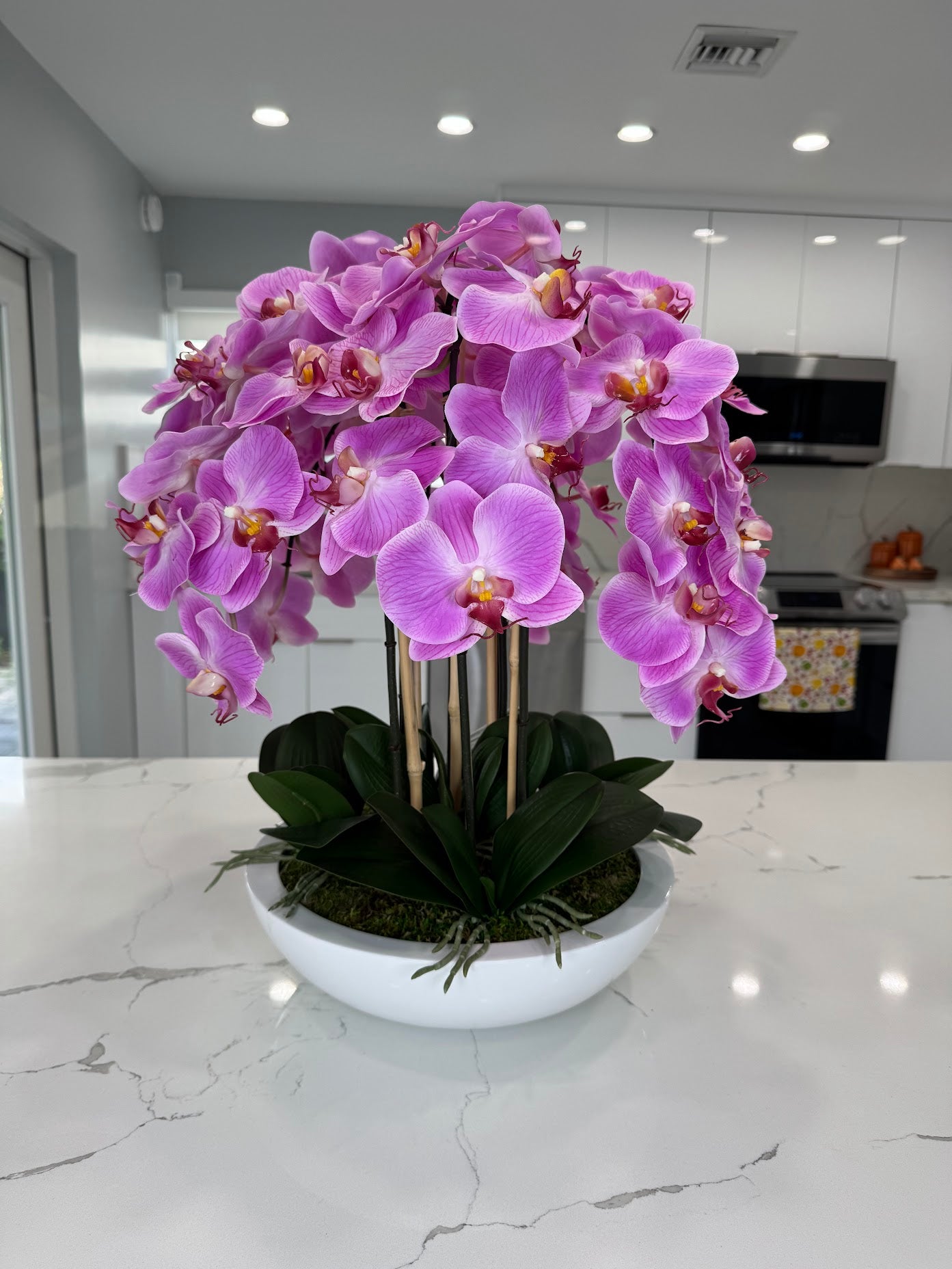 PINK ORCHIDS IN WHITE VASE