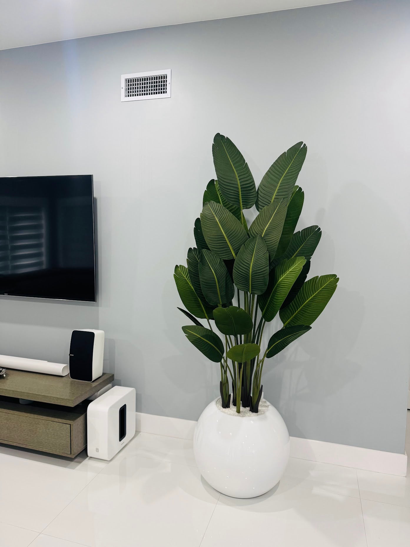 BIRD OF PARADISE IN GLOSSY WHITE GLOBE VASE