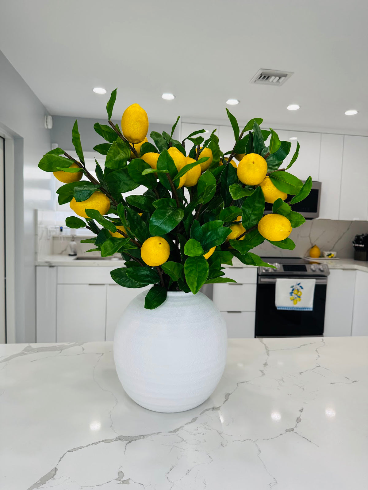 LEMON BRANCH ARRANGEMENT IN TEXTURED WHITE VASE
