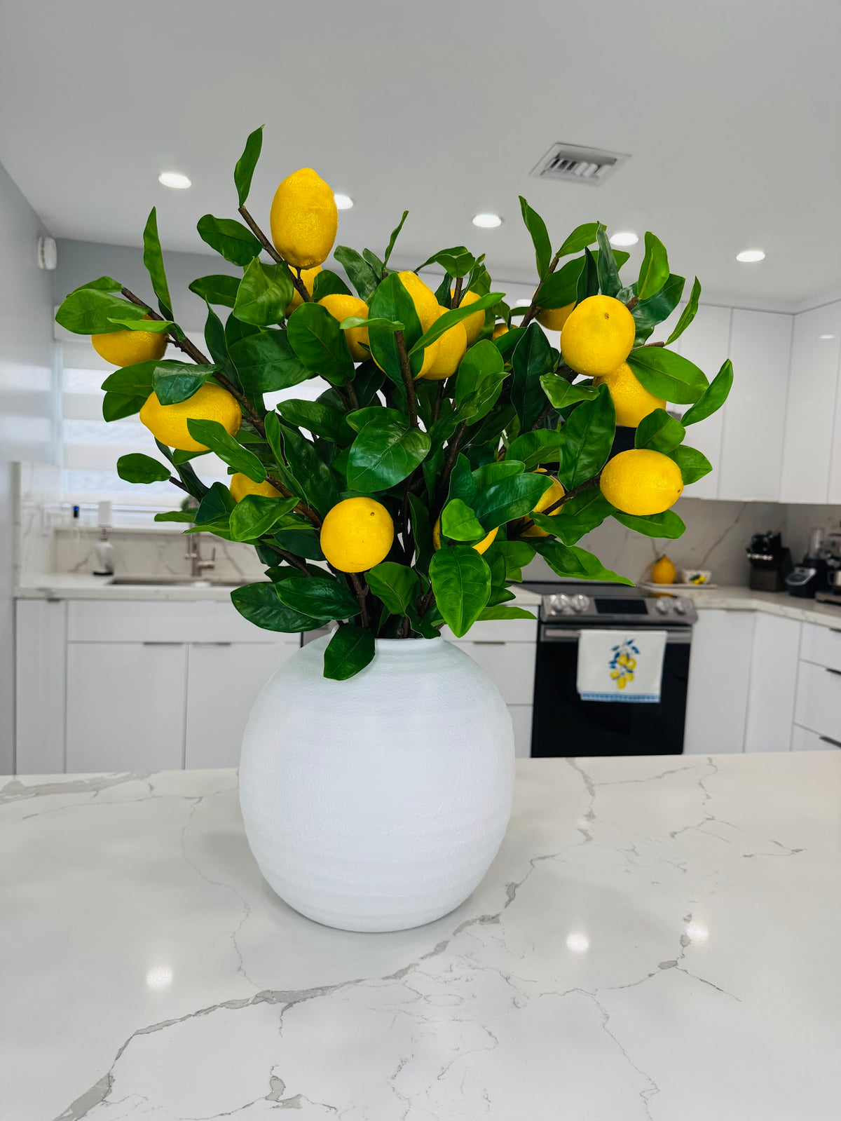LEMON BRANCH ARRANGEMENT IN TEXTURED WHITE VASE