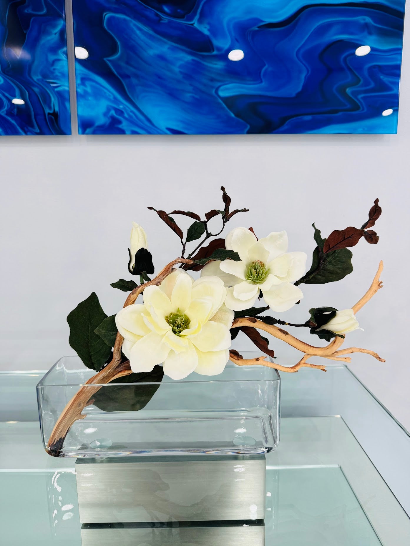 MAGNOLIA WITH BRANCH AND WOOD IN RECTANGULAR VASE