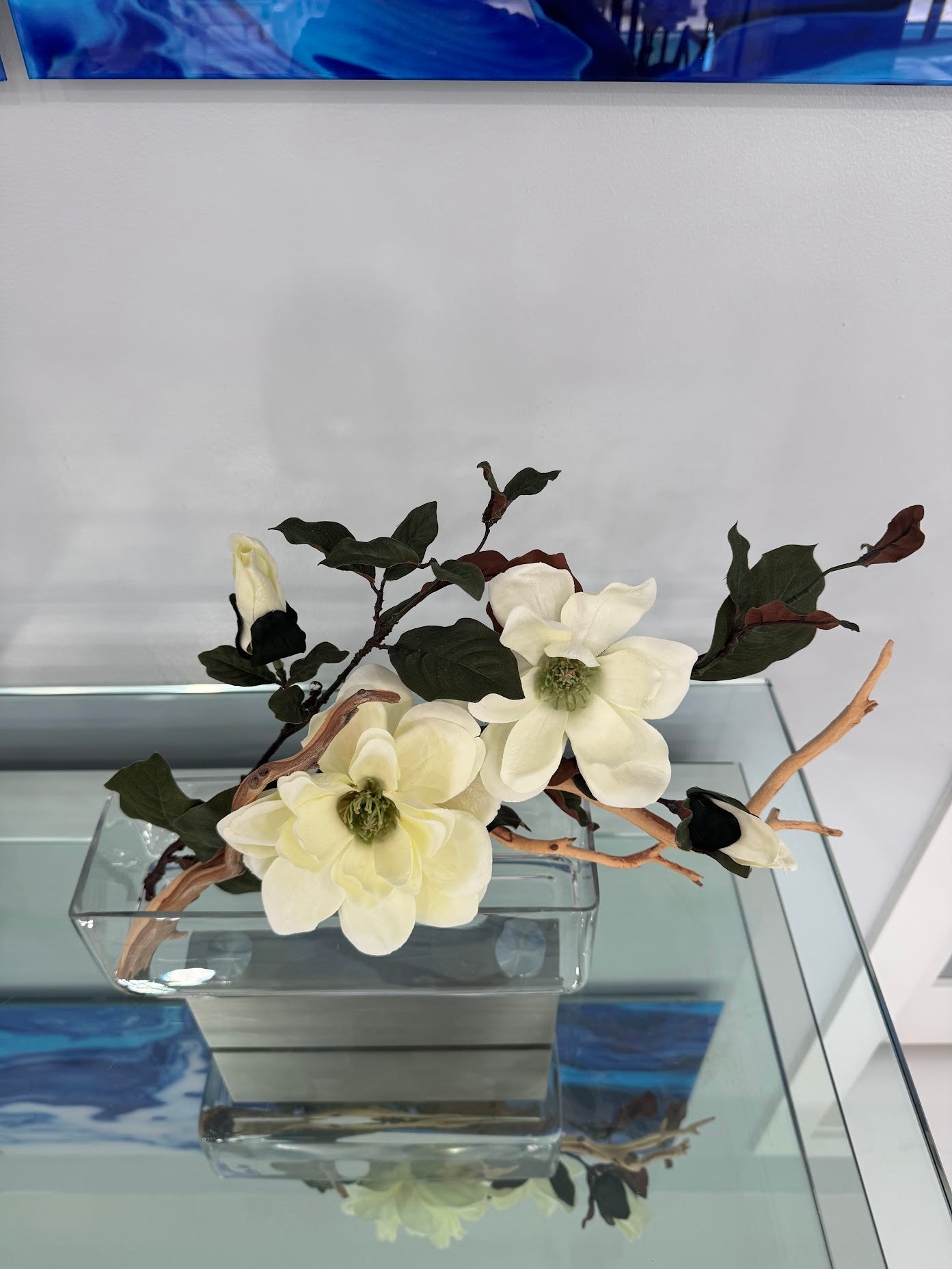 MAGNOLIA WITH BRANCH AND WOOD IN RECTANGULAR VASE