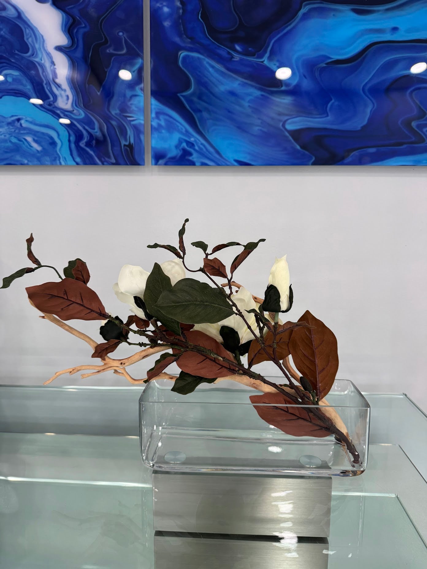 MAGNOLIA WITH BRANCH AND WOOD IN RECTANGULAR VASE