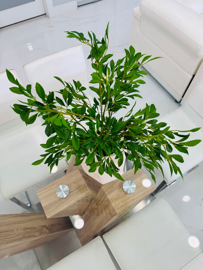 GREEN FOLIAGE ARRANGEMENT IN TEXTURED STONE VASE
