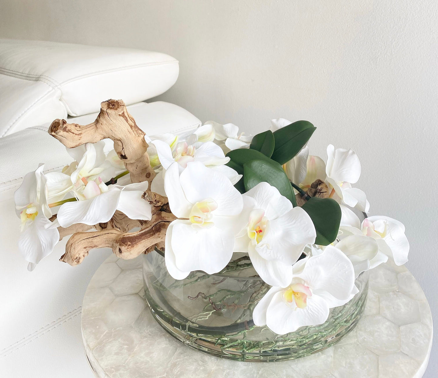 BOWL WITH WHITE ORCHIDS AND WOOD