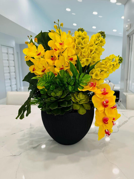 YELLOW ORCHIDS IN BLACK VASE