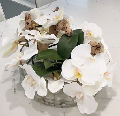 BOWL WITH WHITE ORCHIDS AND WOOD