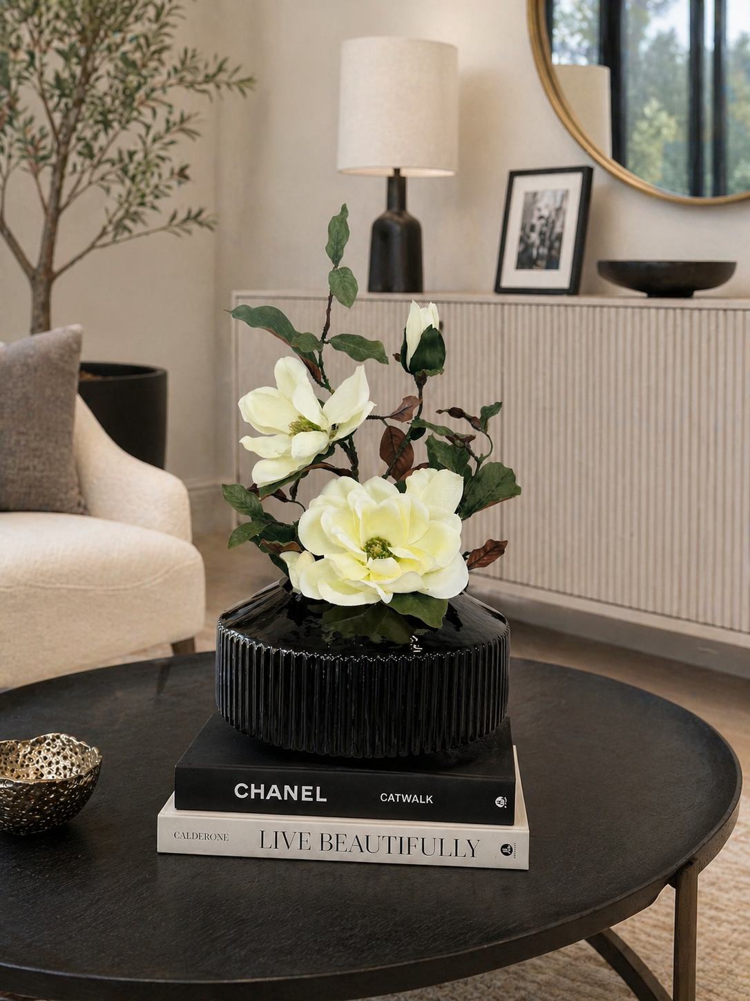MAGNOLIA WITH BRANCH IN BLACK VASE
