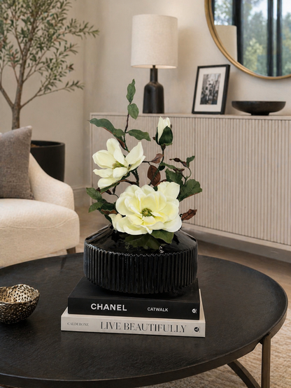 MAGNOLIA WITH BRANCH IN BLACK VASE