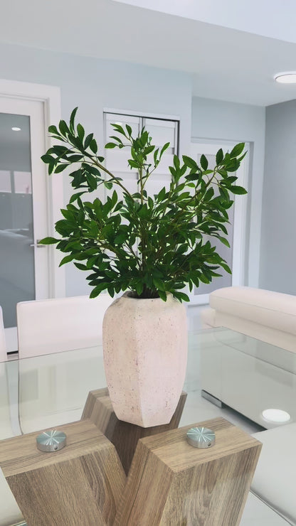 GREEN FOLIAGE ARRANGEMENT IN TEXTURED STONE VASE