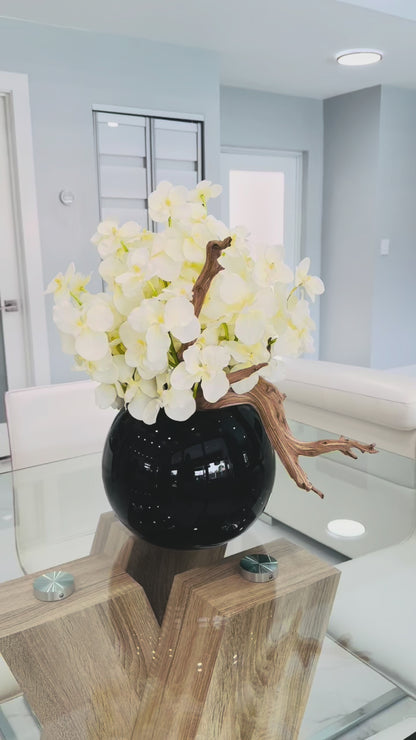 WHITE ORCHID DRIFTWOOD ARRANGEMENT IN BLACK GLOBE VASE